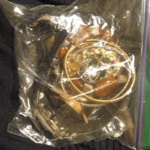 A sandwich Ziploc bag of 2 watches & cheap jewelry